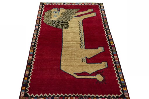 Surface texture of 2000s Persian Gabbeh rug with natural Wool and intricate pattern