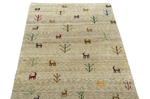 Surface texture of 2000s Persian Gabbeh rug with natural Wool and intricate pattern
