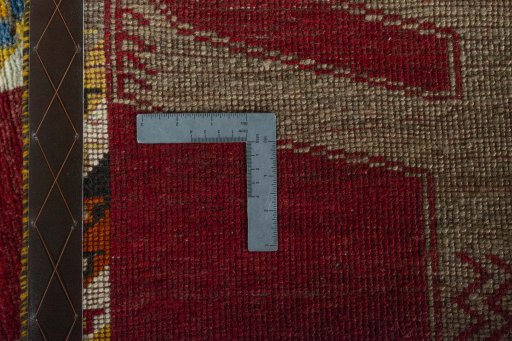 Corner detail of 2000s Persian Gabbeh rug showing border pattern and Wool pile