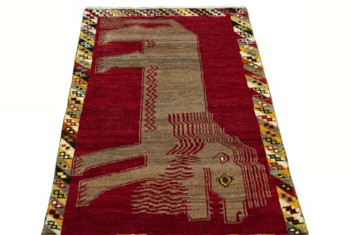 Surface texture of 2000s Persian Gabbeh rug with natural Wool and intricate pattern