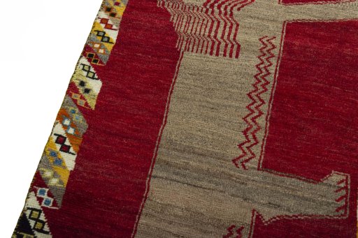 Backside of handmade 2000s Persian Gabbeh rug showing knot structure and weave density
