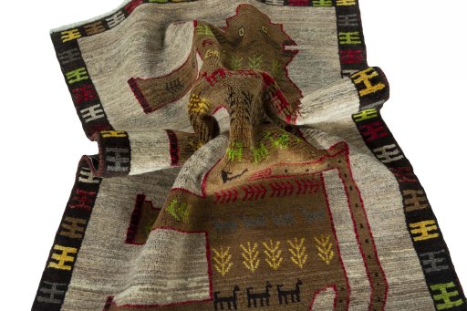 Corner detail of 2000s Persian Gabbeh rug showing border pattern and Wool pile
