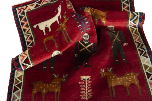 Corner detail of 2000s Persian Gabbeh rug showing border pattern and Wool pile