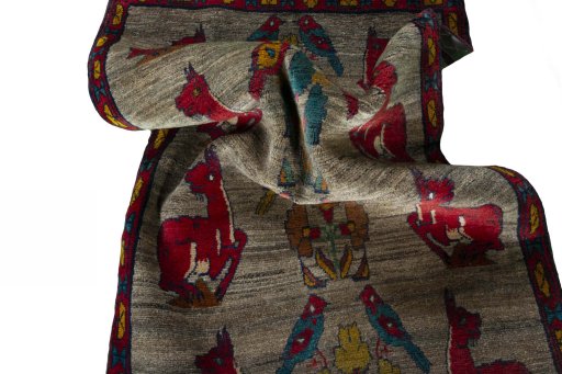 Corner detail of 2000s Persian Gabbeh rug showing border pattern and Wool pile