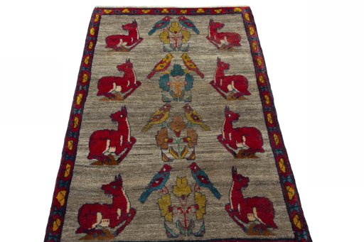 Surface texture of 2000s Persian Gabbeh rug with natural Wool and intricate pattern