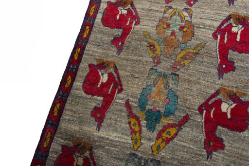 Backside of handmade 2000s Persian Gabbeh rug showing knot structure and weave density