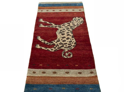Surface texture of 2000s Persian Gabbeh rug with natural Wool and intricate pattern