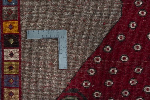Corner detail of 2000s Persian Gabbeh rug showing border pattern and Wool pile
