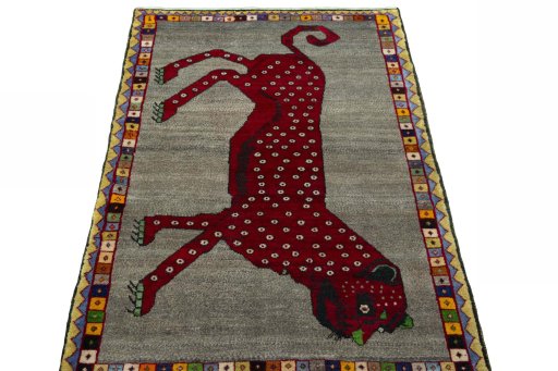 Surface texture of 2000s Persian Gabbeh rug with natural Wool and intricate pattern