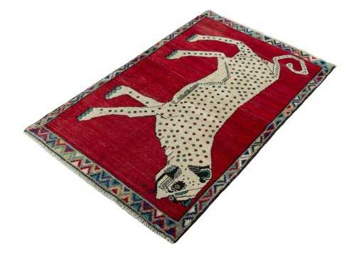 Corner detail of 2000s Persian Gabbeh rug showing border pattern and Wool pile