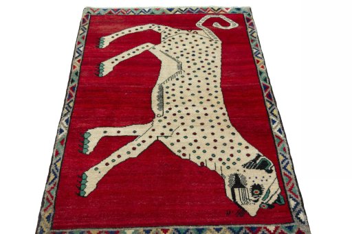 Surface texture of 2000s Persian Gabbeh rug with natural Wool and intricate pattern