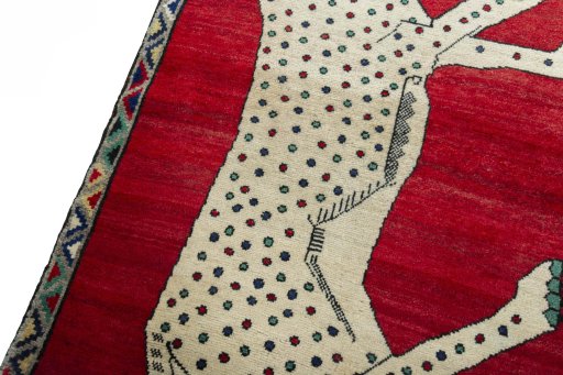 Backside of handmade 2000s Persian Gabbeh rug showing knot structure and weave density