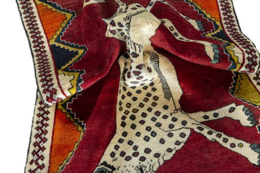 Corner detail of 2000s Persian Gabbeh rug showing border pattern and Wool pile