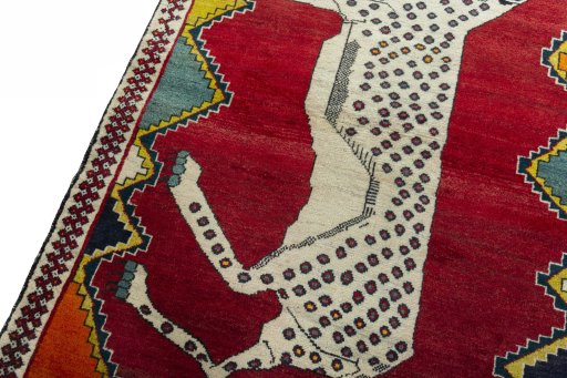 Backside of handmade 2000s Persian Gabbeh rug showing knot structure and weave density