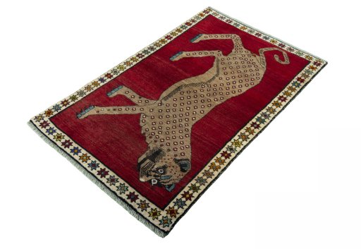 Corner detail of 2000s Persian Gabbeh rug showing border pattern and Wool pile