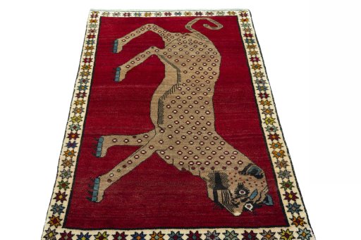 Surface texture of 2000s Persian Gabbeh rug with natural Wool and intricate pattern