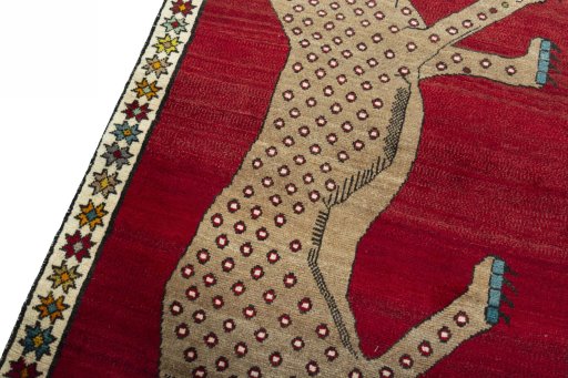 Backside of handmade 2000s Persian Gabbeh rug showing knot structure and weave density