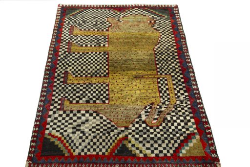 Surface texture of 2000s Persian Gabbeh rug with natural Wool and intricate pattern