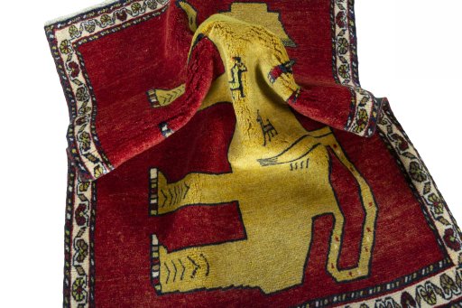 Corner detail of 2000s Persian Gabbeh rug showing border pattern and Wool pile