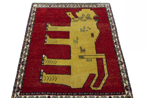 Surface texture of 2000s Persian Gabbeh rug with natural Wool and intricate pattern