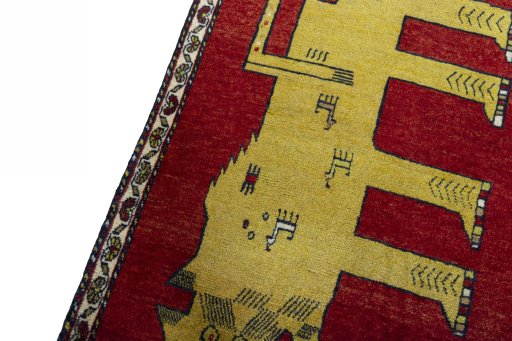 Backside of handmade 2000s Persian Gabbeh rug showing knot structure and weave density