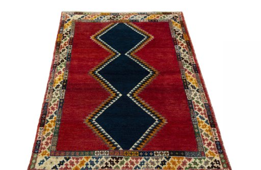 Surface texture of 2000s Persian Gabbeh rug with natural Wool and intricate pattern