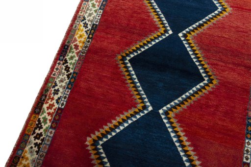 Backside of handmade 2000s Persian Gabbeh rug showing knot structure and weave density