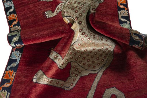 Corner detail of 2000s Persian Gabbeh rug showing border pattern and Wool pile