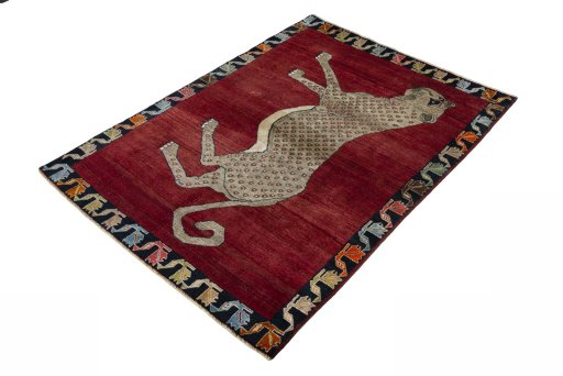 Corner detail of 2000s Persian Gabbeh rug showing border pattern and Wool pile