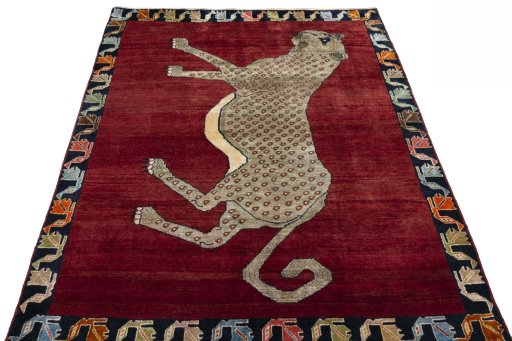 Surface texture of 2000s Persian Gabbeh rug with natural Wool and intricate pattern