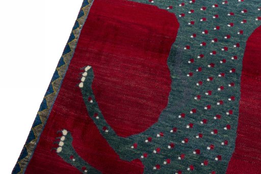 Backside of handmade 2000s Persian Gabbeh rug showing knot structure and weave density