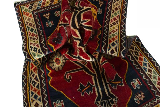 Corner detail of 2000s Persian Gabbeh rug showing border pattern and Wool pile