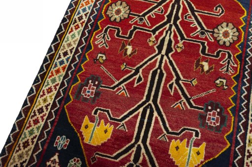 Backside of handmade 2000s Persian Gabbeh rug showing knot structure and weave density