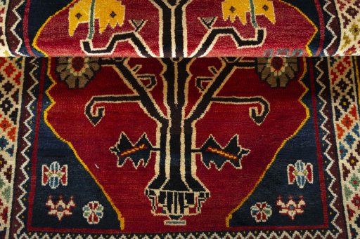 Full view of 2000s Persian Gabbeh rug from Iran / Persia, 150 × 102 cm in Red tones