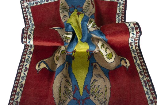 Corner detail of 2000s Persian Gabbeh rug showing border pattern and Wool pile