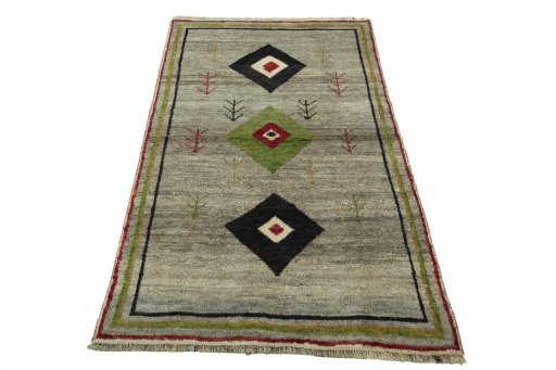 Surface texture of 2000s Persian Gabbeh rug with natural Wool and intricate pattern