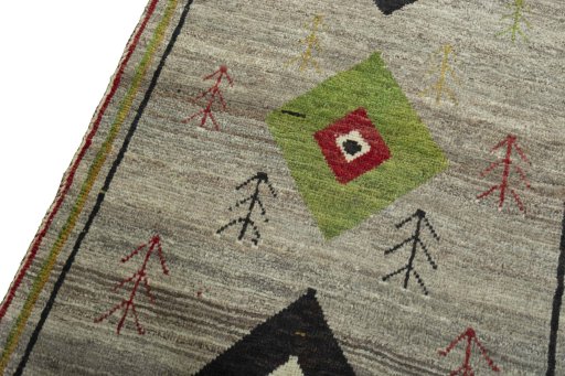 Backside of handmade 2000s Persian Gabbeh rug showing knot structure and weave density