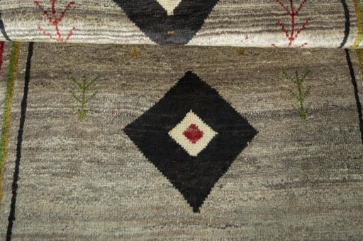 Full view of 2000s Persian Gabbeh rug from Iran / Persia, 196 × 106 cm in Beige tones
