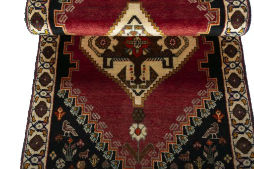Corner detail of 2000s Persian Gabbeh rug showing border pattern and Wool pile