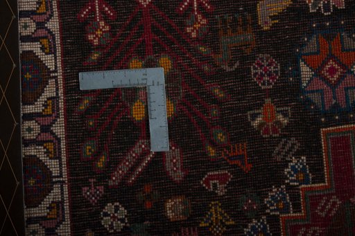 Backside of handmade 2000s Persian Gabbeh rug showing knot structure and weave density