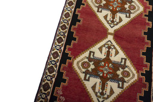 Backside of handmade 2000s Persian Gabbeh rug showing knot structure and weave density