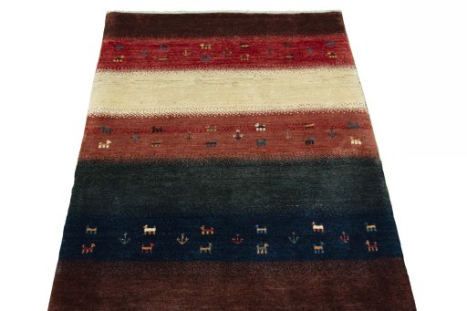 Surface texture of 2000s Persian Gabbeh rug with natural Wool and intricate pattern