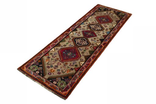 Corner detail of 2000s Persian Gabbeh rug showing border pattern and Wool pile