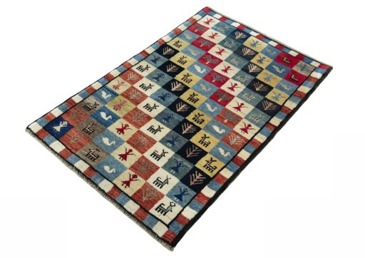 Corner detail of 2000s Persian Gabbeh rug showing border pattern and Wool pile