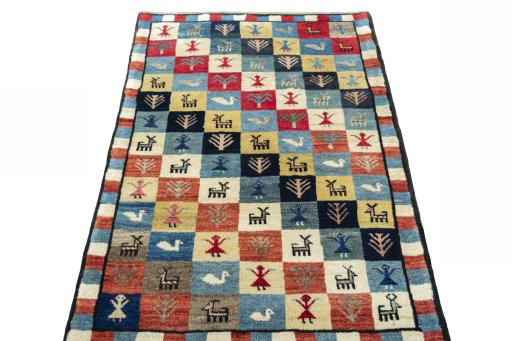 Surface texture of 2000s Persian Gabbeh rug with natural Wool and intricate pattern