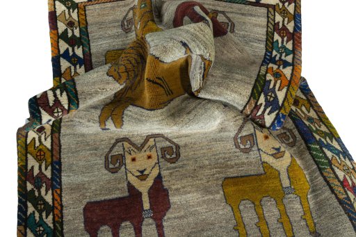 Corner detail of 2000s Persian Gabbeh rug showing border pattern and Wool pile