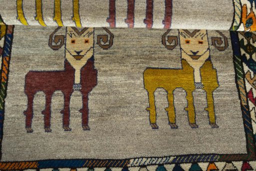 Full view of 2000s Persian Gabbeh rug from Iran / Persia, 171 × 105 cm in Beige tones