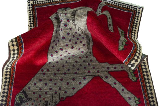 Corner detail of 2000s Persian Gabbeh rug showing border pattern and Wool pile
