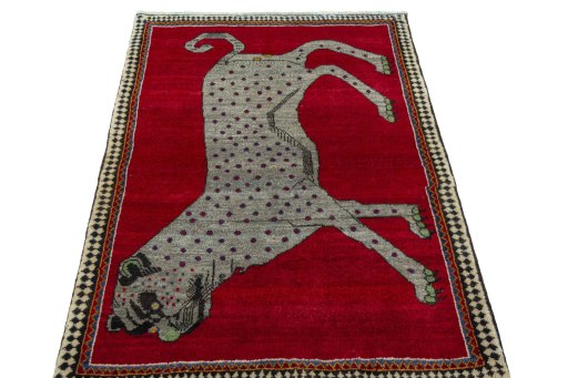 Surface texture of 2000s Persian Gabbeh rug with natural Wool and intricate pattern