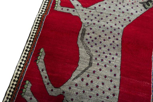 Backside of handmade 2000s Persian Gabbeh rug showing knot structure and weave density